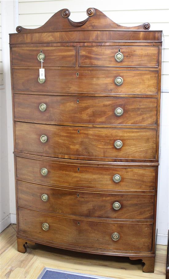 A Regency mahogany bow fronted chest on chest, fitted two short and six graduated long drawers, on bracket feet, W.112cm